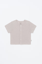 Lucent Short Sleeve Cardigan product shot. Ivory infant summer short-sleeve cardigan laid flat on a clean, light background